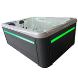 Spa Jacuzzi Wallis 3 places avec habillage Gris et Led extérieur en vert